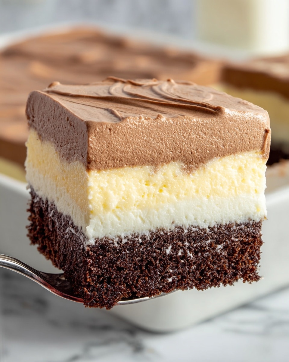 A close-up of a square piece of layered dessert held by a fork, showing four distinct layers: the bottom layer is a dark brown, dense cake; above it is a creamy pale yellow cheesecake layer; next is another thick layer of dark brown cake with a spongy texture; topped with a thick, smooth, and fluffy light brown mousse that appears soft and slightly glossy. The background features the rest of the dessert in a white dish on a white marbled surface. Photo taken with an iphone --ar 4:5 --v 7